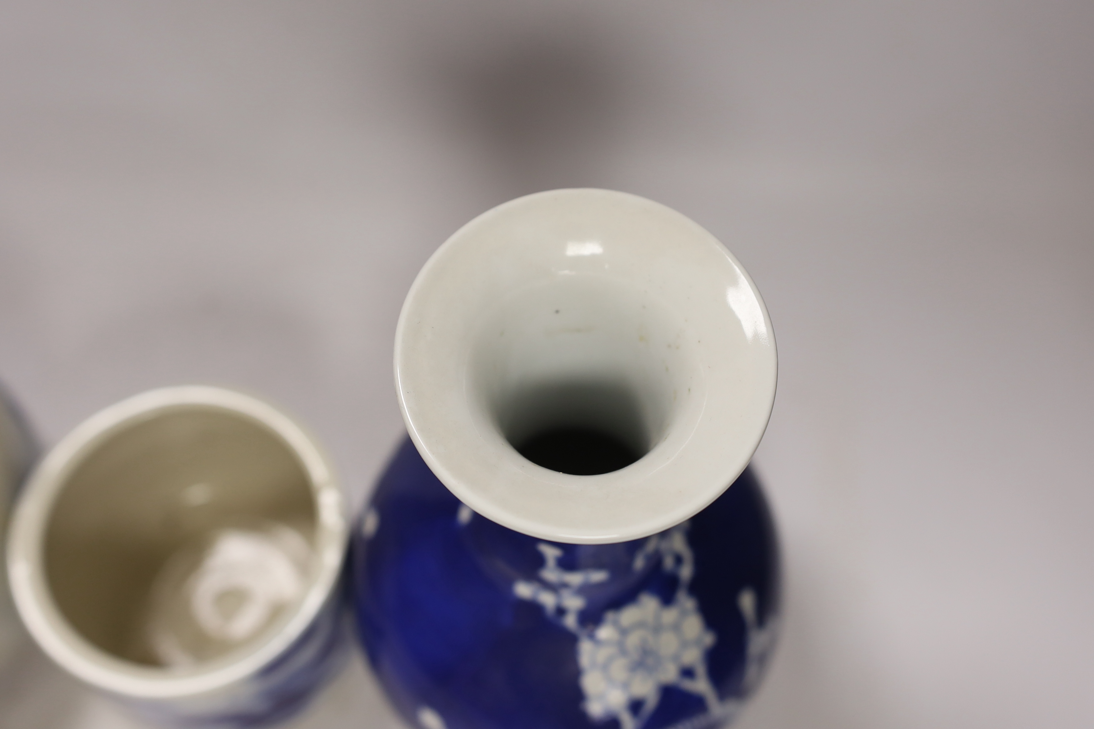 Two Chinese famille rose jars, a similar pot with cover, a brush pot and a vase, 18th century and later, tallest 24cm (5)